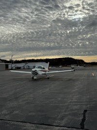 a small airplane parked on the tarmac