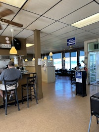 a man sitting at a table in a restaurant