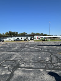 a parking lot with a lot of parked cars