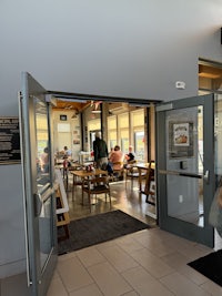 a person sitting at a table in a restaurant
