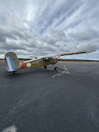 a small airplane is parked on the tarmac