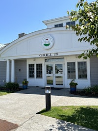 the entrance to a building with a sign on it